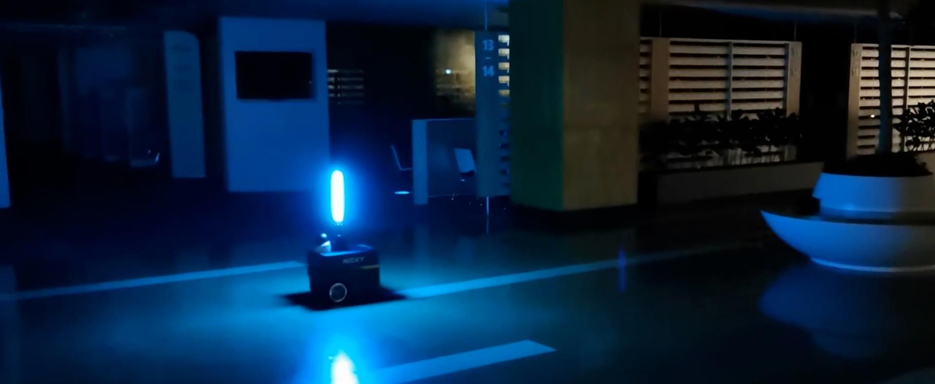 An autonomous robot inside a commercial space with a mounted UV light disinfects building interiors. 