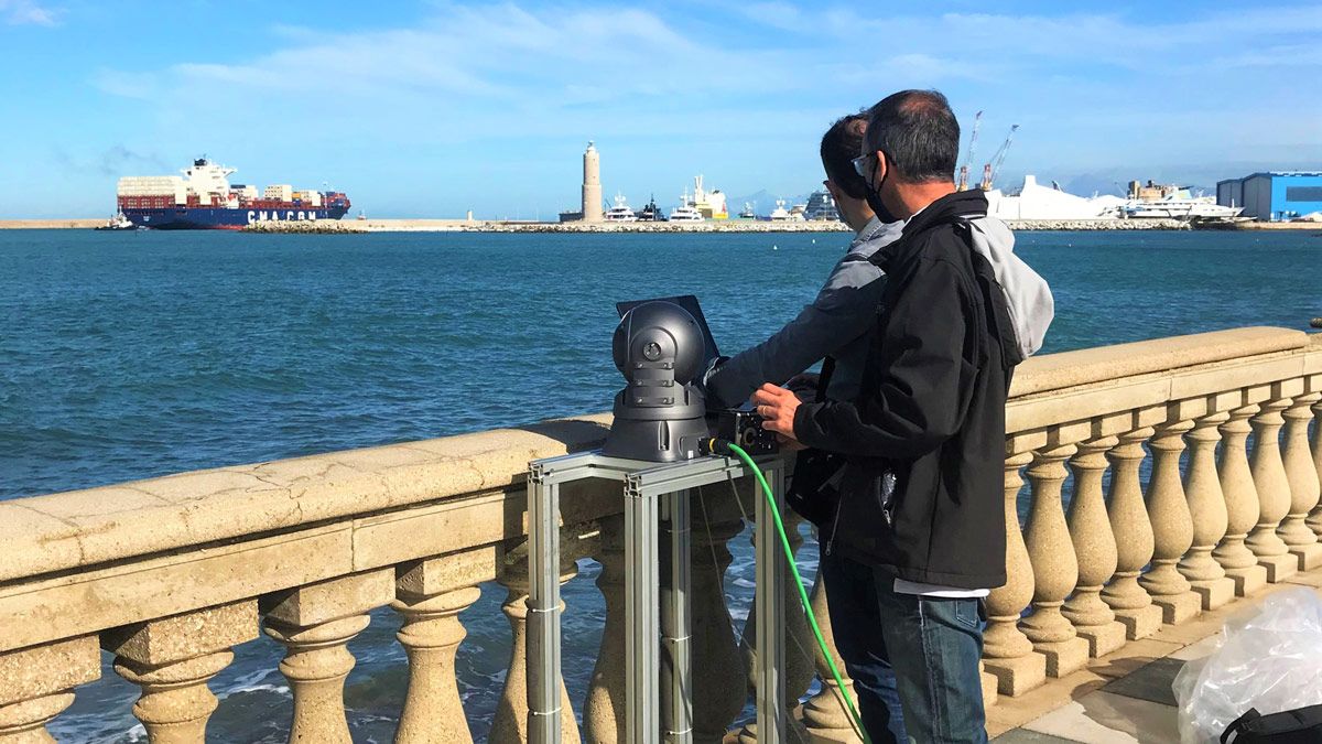 Two members of the Drass team look over a harbor as they perform object detection tests with their equipment.