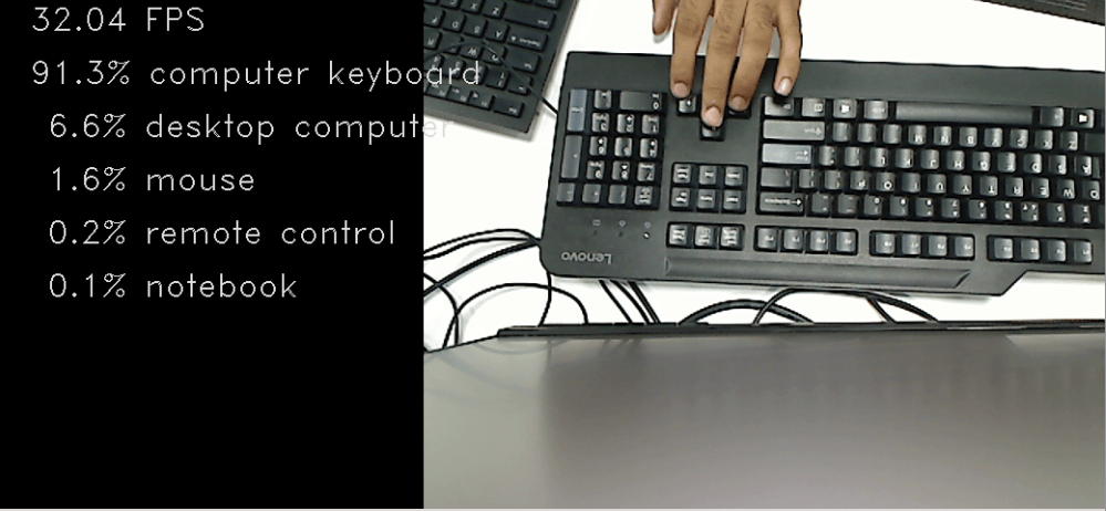 Webcam feed from the generated application showing a keyboard. ResNet50 classifies it as computer keyboard at 91.3% confidence and runs at 32.04 FPS.