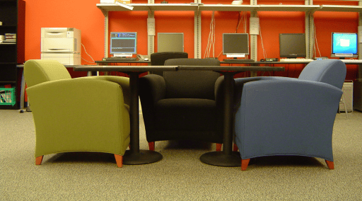 Three armchairs around a table