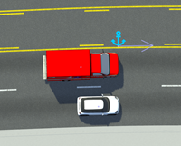 Front bumpers of red ambulance and white car aligned with anchor